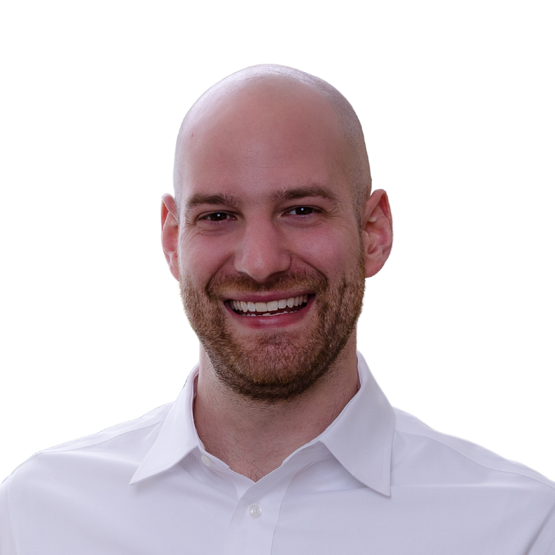 COO of ERP Strategies, Nic, wearing a white shirt and smiling at the camera